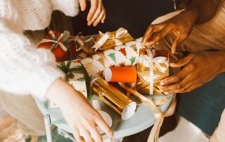 Two people wrapping gifts for musicians