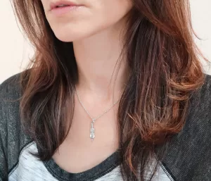 Woman wearing silver cello necklace