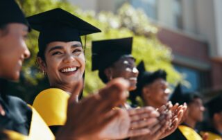students applausing during graduation