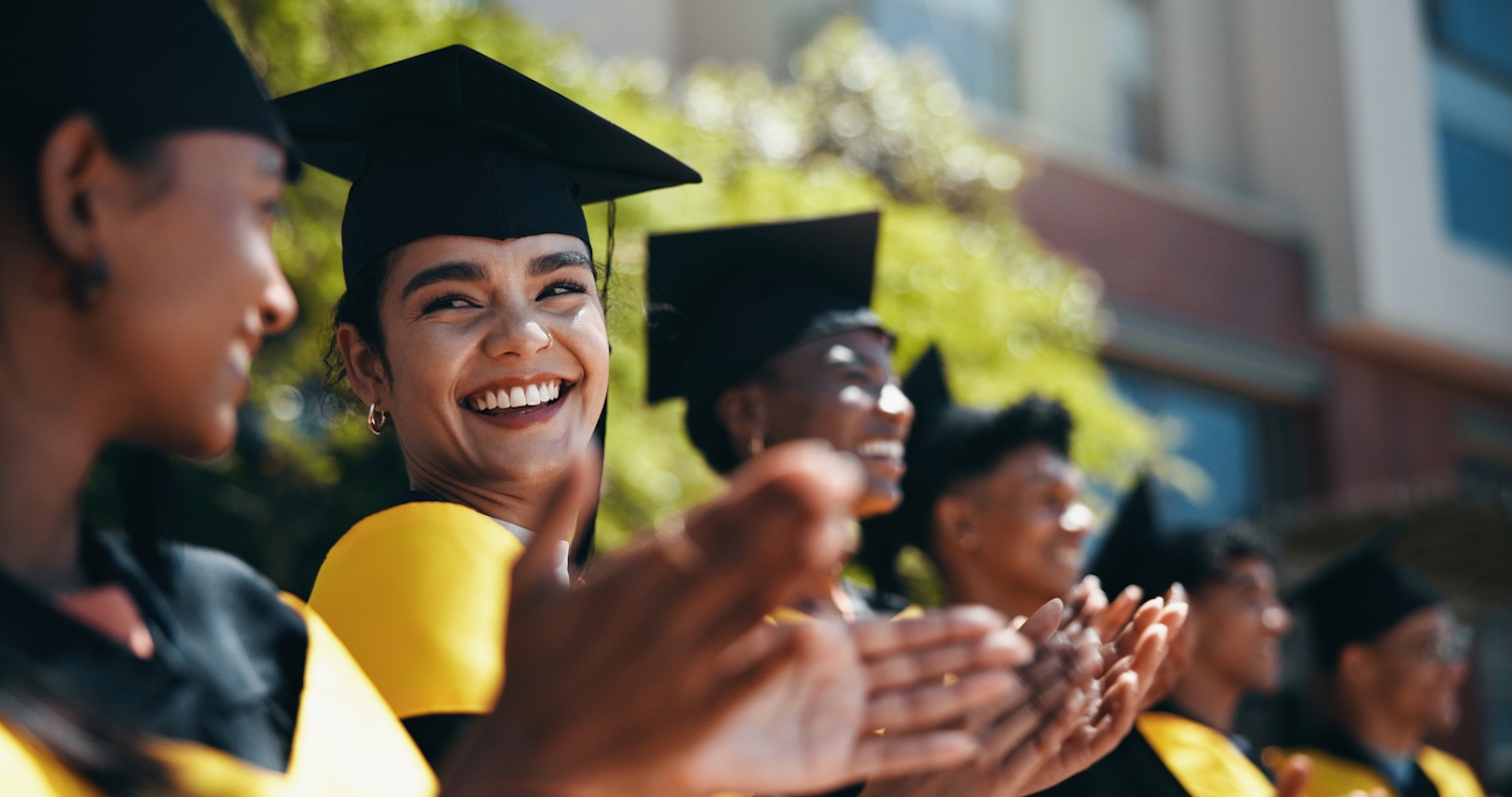 students applausing during graduation