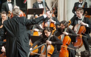 conductor leading an orchestra
