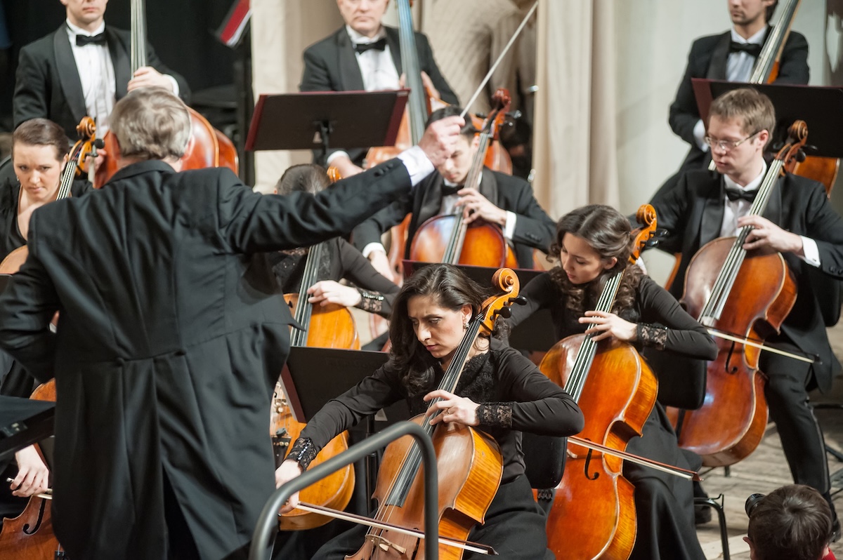 conductor leading an orchestra